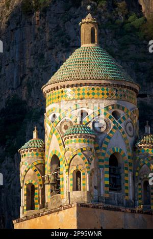 Belltower of the Duomo di Sant Andrea (St Andrew's cathedral). Amalfi, Salerno, Italy  Amalfi Coast. Begun in the 9th and 10th centuries, the cathedral it has been added to and redecorated several times, overlaying Arab-Norman, Gothic, Renaissance, Baroque elements, and finally a new 19th century Norman-Arab-Byzantine facade. Stock Photo