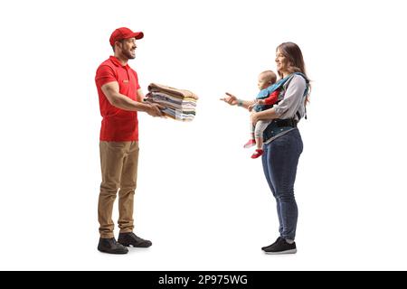 Man delivering a pile of folded clothes to a mother with a baby clothes isolated on a white background Stock Photo