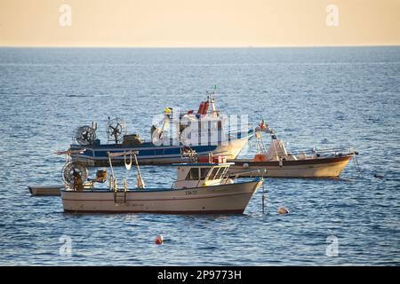 Small fishing boats on the sea off Positano on the Amalfi Coast, near Naples. Salerno, Italy Stock Photo