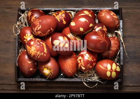Traditional easter eggs dyed in onion peel. Light Easter holiday. Religious traditions. Stock Photo