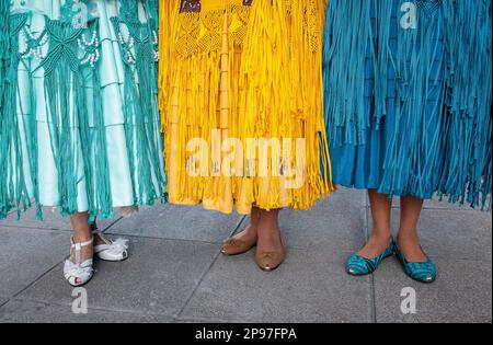 Detail of dresses and feet. At left Benita la Intocable , in the middle Angela la Folclorista, and at right Dina, cholitas females wrestlers, El Alto, Stock Photo