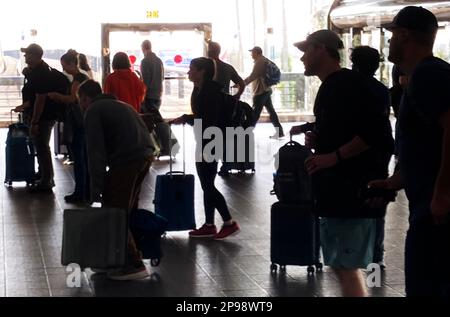 Orlando, Florida, USA. 10th Mar, 2023. Travelers wait for a tram at Orlando International Airport during the busy spring break travel period in Orlando. 7.3 million passengers are expected to pass through the Orlando airport for spring break beginning this week through April 18th. (Credit Image: © Paul Hennessy/SOPA Images via ZUMA Press Wire) EDITORIAL USAGE ONLY! Not for Commercial USAGE! Stock Photo