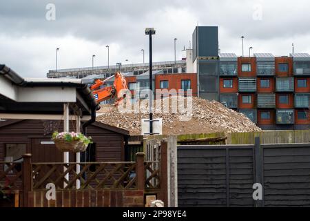 Maidenhead, Berkshire, UK. 10th March, 2023. The demolition of the former popular Magnet Leisure Centre and indoor swimming pool in Maidenhead Town Centre is nearing completion. The Magnet will be replaced with 434 homes as part of the Maidenhead Regeneration Scheme. The demolition work is taking place next to residental houses and residents are having to endure both noise and dust from the demolition works. Credit: Maureen McLean/Alamy Live News Stock Photo