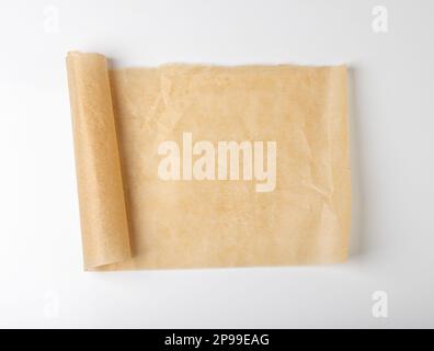 Crumpled Baking Paper, Kraft Cooking Paper Sheet Texture Background, Bakery Parchment Mockup, Greaseproof Material, Baking Paper on Wood Background To Stock Photo