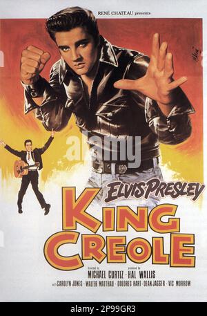 1958 : The advertising poster  for the movie KING CREOLE    by Michael Curtiz  with  ELVIS PRESLEY  - FILM - CINEMA   - poster pubblicitario - poster - advertising - locandina - JEANS  ----   Archivio GBB Stock Photo