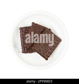 Chocolate Biscuit on Saucer Isolated, Black Quadratic Cookie, Dark Soft Biscuits, Square Butter Cookies, Fresh Sweet Cocoa Cracker on White Background Stock Photo