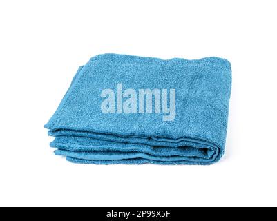 Folded Blue Towel Isolated. New Terry Cotton Towel, Soft Washcloth on White Background Stock Photo