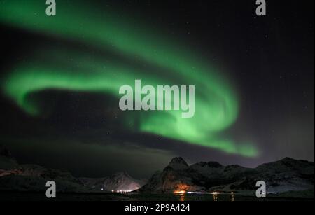 Skagsanden Beach, Flaksted, Lofoten Islands, Norway. 10 March, 2023. The Aurora Borealis, or Northern Lights, visible in the sky over northern Norway, and reflected in the sand on the beach. Credit: Glyn Thomas/Alamy Live News Stock Photo