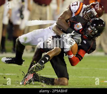 Virginia Tech's Kam Chancellor (17) celebrates his interception with  teammate Nekos Brown (47) during the second quarter against Cincinnati  during the Orange Bowl NCAA college football game in Miami, Thursday, Jan.  1,