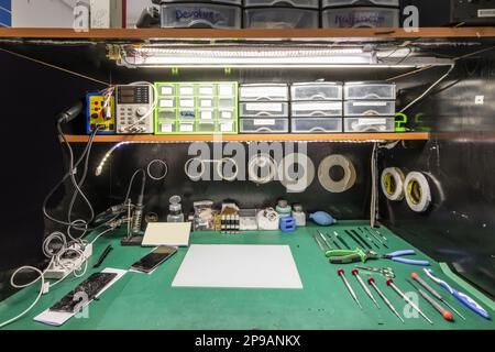 A modest smartphone distribution workshop in a sales store and repairs Stock Photo