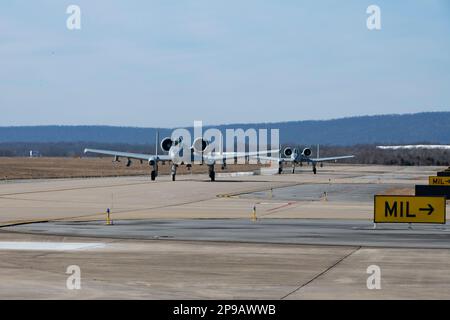 Two A-10C Thunderbolt II aircraft from the @175thWing, Maryland Air National Guard, flew into Shepherd Field, Martinsburg, West Virginia, Feb. 11, for a hot refueling training mission with Airmen from the 167th  Fuels Management Flight. Hot refueling is the transfer of fuel from a non-aircraft source to an aircraft having one or more engines running and is one of several types of specialized fueling operations that increase efficiency and flexibility for aircraft to conduct Agile Combat Employment operations. (U.S. Air National Guard photos by Senior Master Sgt. Emily Beightol-Deyerle) Stock Photo