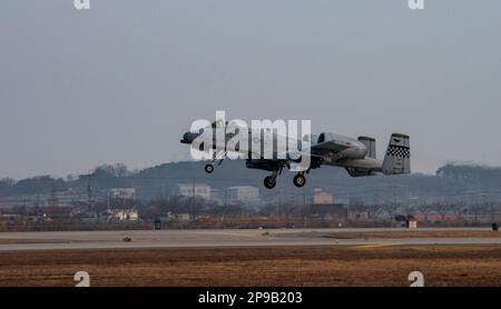 An A-10C Thunderbolt II assigned to the 25th Fighter Squadron takes off for a training mission during Buddy Squadron 23-2 at Osan Air Base, Republic of Korea, March 8, 2023. The 25th FS integrated with the 102nd FS from Daegu Air Base to share best practices and increase readiness to ensure the security and stability of the Korean peninsula. (U.S. Air Force photo by Staff Sgt. Dwane R. Young) Stock Photo