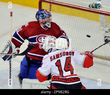 Montreal Canadiens' Sergei Samsonov, center, slides into Boston