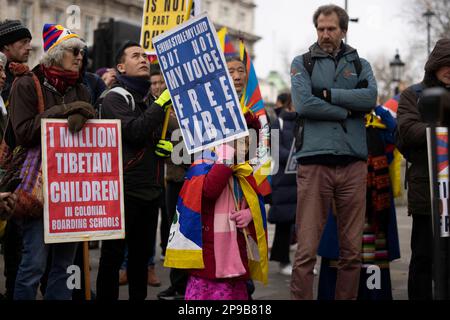 London, UK. 10th Mar, 2023. Protesters hold placards expressing their opinion during the demonstration. Hundreds of Tibetans residing in London marched from Downing Street to the Embassy of China in London on the 64th anniversary of the Tibetan National Uprising Day. The march commemorates tens of thousands of Tibetans rising up against China's illegal invasion and occupation of their homeland on 10th March 1959. (Photo by Hesther Ng/SOPA Images/Sipa USA) Credit: Sipa USA/Alamy Live News Stock Photo