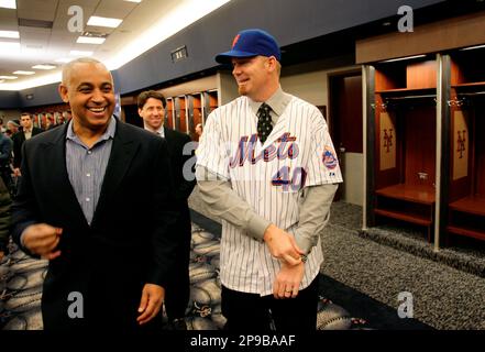 Omar Minaya, right, general manager of the Montreal Expos, announces the  return of the team to Puerto Rico at the San Juan Hotel & Casino in San  Juan, Wed., Dec. 17, 2003.