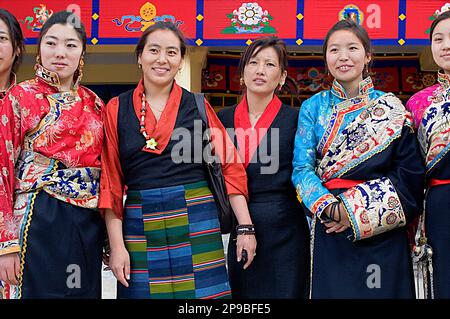 Tibetan women wearing typical dress , in Namgyal Monastery,in Tsuglagkhang complex. McLeod Ganj, Dharamsala, Himachal Pradesh state, India, Asia Stock Photo