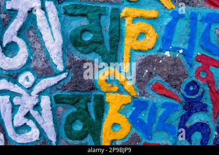 inscriptions on prayer carved stones in Lhagyal Ri,near Tsuglagkhang complex,McLeod Ganj, Dharamsala, Himachal Pradesh state, India, Asia Stock Photo