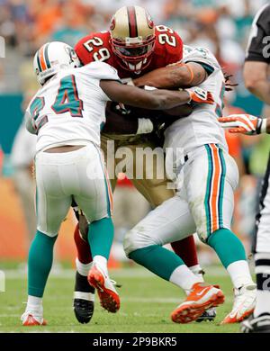 Miami Dolphins Renaldo Hill (24) applies pressure as Baltimore Ravens Mark  Clayton (89) is unable to catch a pass during the second half of their  Sunday, Jan. 4, 2009, NFL playoff football