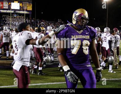 https://l450v.alamy.com/450v/2p9btgn/montanas-andrew-swink-puts-his-hand-on-the-shoulder-of-james-madisons-theo-sherman-after-the-ncaa-div-1-aa-semifinal-college-football-game-in-harrisonburg-va-on-friday-night-dec-12-2008-montana-beat-james-madison-35-27-ap-photosrichmond-times-dispatch-p-kevin-morley-2p9btgn.jpg