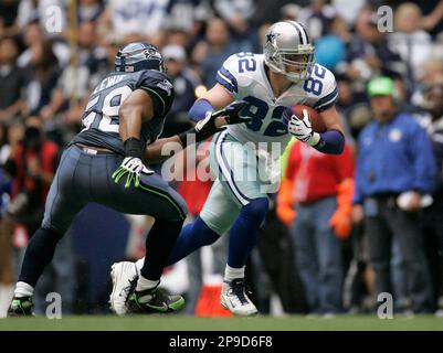 Seattle Seahawks' linebacker D.D. Lewis (54) hits Indianapolis Colts' wide  receiver Troy Rogers as he catches the ball during the second quarter of an  NFL football game Saturday, Dec. 24, 2005 in