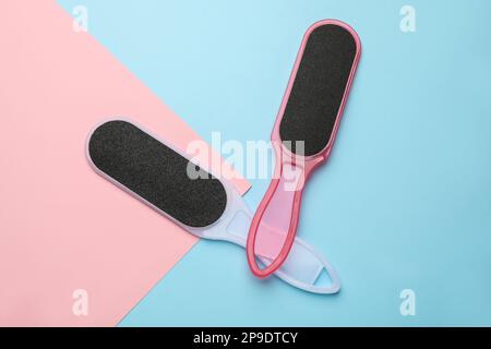 Foot files on color background, flat lay. Pedicure tools Stock Photo