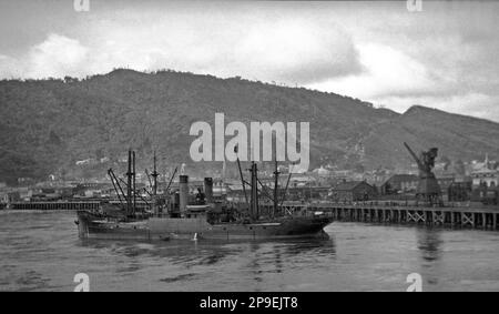 Unknown ship in the Grey River, Greymouth Port, Westland, New Zealand, probably in the 1930s. Stock Photo