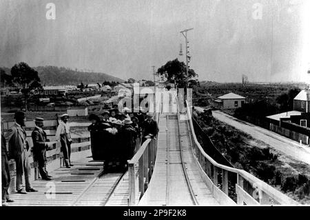 Wagon loaded with passengers on tram line, Greymouth, Westland, New Zealand. Stock Photo