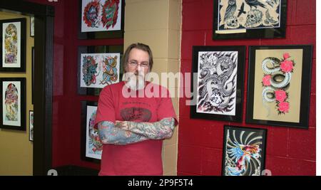 Going for the Gold: New Gold Snake Tattoo Shop Ready to Leave a...