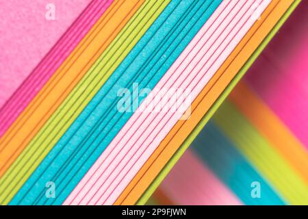 Vibrant sheets of assorted cardstock layered on the diagonal. Stock Photo