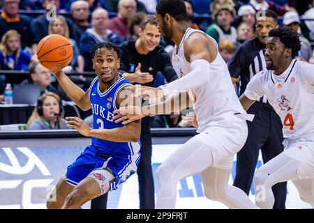 March 10, 2023: Duke Blue Devils guard Jeremy Roach (3) drives on Miami (Fl) Hurricanes forward A.J. Casey (0), center, during the semifinals round of the Men's ACC Tournament at Greensboro Coliseum in Greensboro, NC. (Scott Kinser/Cal Sport Media) Stock Photo