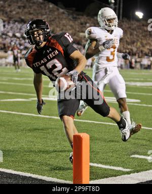 Texas Tech quarterback Graham Harrell (6) passes as Texas A&M defender Danny  Gorrer (4) looks on during the first half of their football game in  Lubbock, Texas, Saturday, Oct. 13, 2007. Harrell