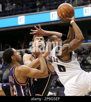 Washington Wizards guard Antonio Daniels (6) and forward Antawn Jamison (4)  walk down the court in the final second of the second half in game four of  the Eastern Division Playoffs on