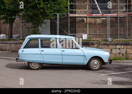 Pleyber-Christ, France - July 04 2021: Couple driving their Citroën Ami 8 break. Stock Photo