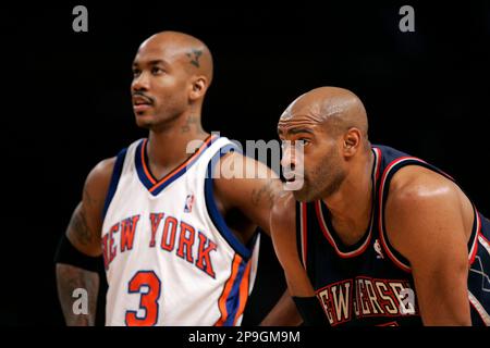 New Jersey Nets' Stephon Marbury (33) drives toward Boston Celtics' Kenny  Anderson (7) and Vitaly Potapenko, left, during the first quarter Friday,  Feb. 4, 2000, in Boston. (AP Photo/Lisa Poole Stock Photo - Alamy
