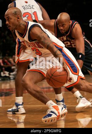 New Jersey Nets' Stephon Marbury (33) drives toward Boston Celtics' Kenny  Anderson (7) and Vitaly Potapenko, left, during the first quarter Friday,  Feb. 4, 2000, in Boston. (AP Photo/Lisa Poole Stock Photo - Alamy