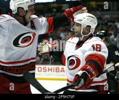 Carolina Hurricanes left wing Ryan Bayda (18) gets grabbed from behind by  Atlanta Thrashers forward Eric Boulton (36) during a scuffle in the second  period of an NHL hockey game Wednesday, March