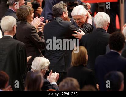 German Foreign Minister Frank-Walter Steinmeier, right, thanks former German Chancellor Gerhard Schroeder for his applause after his speech during a special SPD party congress in Berlin, Country, Saturday, Oct. 18, 2008. Germany's social Democrats will elect Franz Muentefering as new party leader and Steinmeier as their chancellor candidate for the 2009 election. At left sits former Chancellor Helmut Schmidt. (AP Photo/Miguel Villagran)