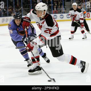 Czech Republic forward Patrik Elias, right, trips over Switzerland forward  Thierry Paterlini during first period action at the IIHF world hockey  championships, Thursday May 8, 2008, in Quebec City. (AP Photo/The Canadian