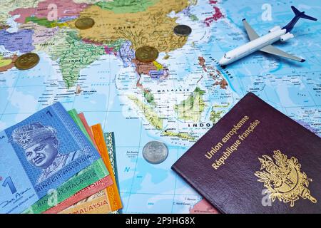 Kuala Lumpur, Malaysia - February 19 2019: Composition made of a world map focused on Southeast Asia with on it, some Malaysian ringgit banknotes and Stock Photo