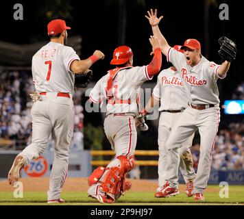 Philadelphia Phillies' Brad Lidge, right, and Carlos Ruiz celebrate after  winning Game 5 of the National League Championship baseball series against  the Los Angeles Dodgers Wednesday, Oct. 21, 2009, in Philadelphia. The