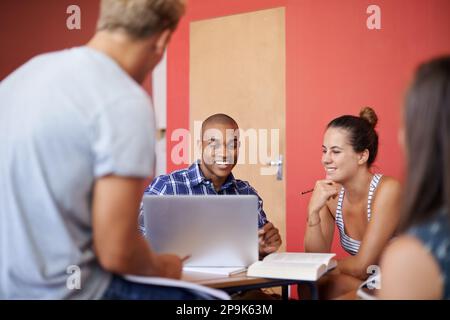 Taking time out from studying. a group of university students studying together. Stock Photo