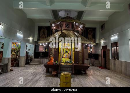 Beautifully decorated idol of Sri Lord Krishna Temple with flowers garlands and lights at Krishna Dhama, Mysuru. MYSORE, KARNATAKA, INDIA - FEB 2023 Stock Photo