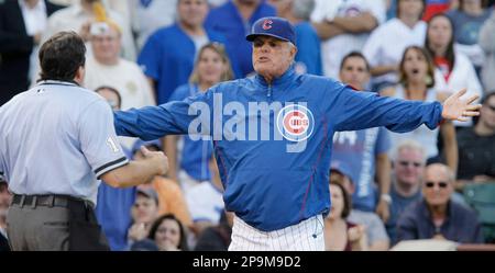 Chicago Cubs manager Lou Piniella (R) argues with home plate umpire Ed  Rapuano (C) after Rapuano ejected Jim Edmonds for arguing ball and strikes  during the 11th inning against the Milwaukee Brewers