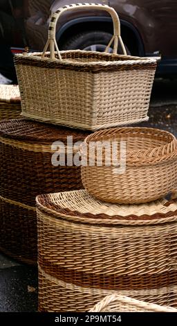 Many different wicker baskets made of natural material close-up at the fair Stock Photo