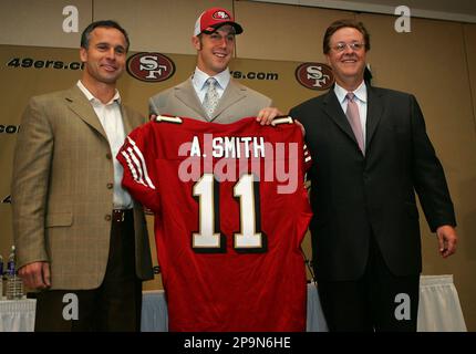 Utah quarterback Alex Smith, left, holds up a San Francisco 49ers jersey  with NFL commissioner Paul Tagliabue after the 49ers selected him as the  No. 1 overall pick in the NFL Draft