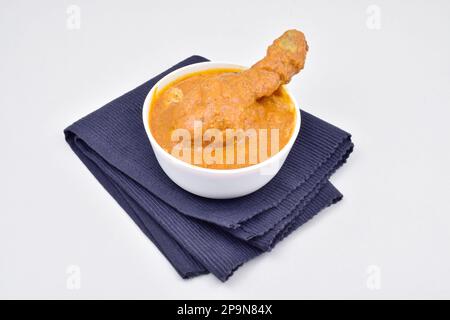 Bowl of butter chicken isolated on white background Stock Photo