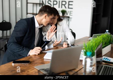 discussion of the company's business by the team sitting at the common table Stock Photo
