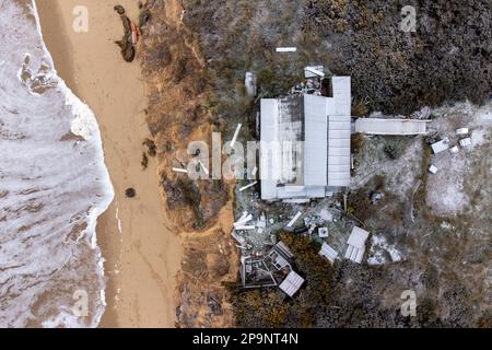 Houses close to the cliff edge at Hemsby in Norfolk, where a number of ...