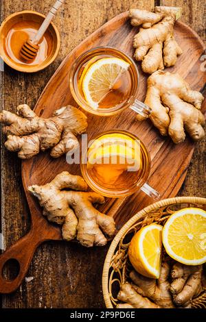 Ginger tea with lemon and honey on a wooden table Stock Photo