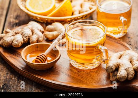 Ginger tea with lemon and honey on a wooden table Stock Photo